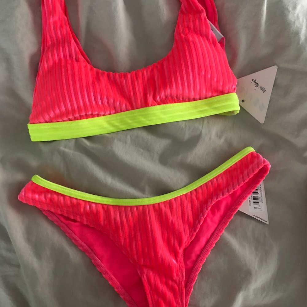 Dippin' Daisys Festival top and Viva bottoms neon pink with neon green trim